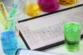 Digital tablet with periodic system of elements lying on table in laboratory closeup