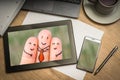 Digital tablet with three happy fingers on screen