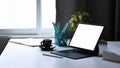 Tablet with wireless keyboard, potted plant, coffee cup and stationery on white table. Royalty Free Stock Photo