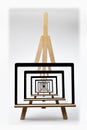 Digital tablet on a wooden table easel multiplied on a screen Royalty Free Stock Photo