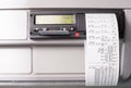 Digital tachograph with printed time records and driver card half inserted