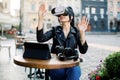 Digital technology, virtual reality. Happy positive young brunette woman, moving hands while trying VR glasses headset Royalty Free Stock Photo