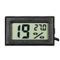 Digital thermo-hygrometer with numbers on the LCD display Royalty Free Stock Photo