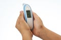 Digital thermometer in hands Royalty Free Stock Photo