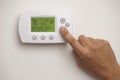 Digital Thermostat and male hand Royalty Free Stock Photo