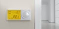 Digital thermostat on white wall. Home heat temperature control device close up. 3d render Royalty Free Stock Photo