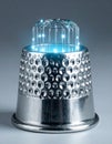 Digital Thimble with Glowing Blue Technology Royalty Free Stock Photo