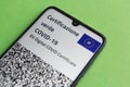 The digital vacination Covid -19 certificate of the european union with QR code on smartphone screen. Green pass