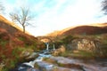 Digital watercolour of an autumnal waterfall and stone packhorse bridge at Three Shires Head in the Peak District.