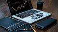 Digital Workspace with Laptop, Coffee Cup, Notebook, Glasses, and Financial Chart Display Royalty Free Stock Photo