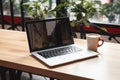 Digital workspace Mockup laptop with blank screen on a table