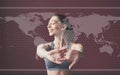 Digital world map on picture. Young woman with slim body shape in sportswear have fitness day indoors