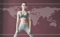 Digital world map on picture. Young woman with slim body shape in sportswear have fitness day indoors