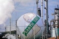 Digitally altered view of a tank painted as a globe with the words Ã¯Â¿Â½Earth DayÃ¯Â¿Â½ at a Unocal oil refinery in Los Angeles, CA