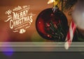 Digitally composite image of merry christmas and happy new year message against christmas bauble Royalty Free Stock Photo