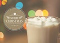 Digitally composite image of merry christmas message against a cup of hot chocolate Royalty Free Stock Photo