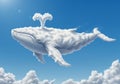 A digitally created image depicts a whale-shaped cloud floating in a vibrant blue sky. Royalty Free Stock Photo
