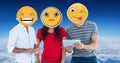 Digitally generated image of friends faces covered with emoji using digital tablet and smart phone a Royalty Free Stock Photo