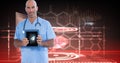 Digitally generated image of male doctor showing digital tablet against tech graphics Royalty Free Stock Photo