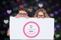 Digitally generated image of nerd couple holding placard with valentines message Royalty Free Stock Photo