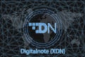 Digitalnote XDN Abstract Cryptocurrency. With a dark background and a world map. Graphic concept for your design Royalty Free Stock Photo