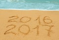 Digits 2016 and 2017 on the sand Royalty Free Stock Photo
