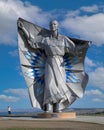 Dignity Statue towers over lone tourist