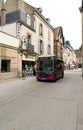 Electric public transport bus in the historic old town of Dijon in Burgundy