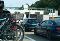 Many cars passing through a toll booth stop in heavy summer holiday traffic on the French highway system