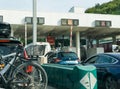 Many cars passing through a toll booth stop in heavy summer holiday traffic on the French highway system