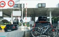 Many cars passing through a toll booth stop in heavy summer holiday traffic on the French highway system