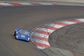 Blue racing car at full speed in Dijon