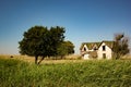 Dilapidated Abandoned Farm House in a Field in Oklahoma Royalty Free Stock Photo