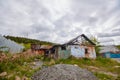 A dilapidated abandoned house in the countryside. There are signs of fire, desolation and old junk Royalty Free Stock Photo