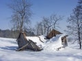 Dilapidated alpine hut in winter Royalty Free Stock Photo
