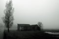 Dilapidated barn in fog Royalty Free Stock Photo