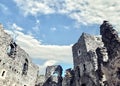 Dilapidated castle on the mountain, ruins and blue sky