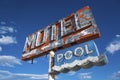 A dilapidated, vintage motel sign in the desert of Arizona