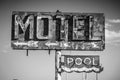 A dilapidated, vintage motel sign in the desert of Arizona