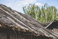 A dilapidated, collapsing village roof