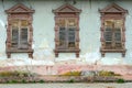 Dilapidated house with broken windows and shutters Royalty Free Stock Photo