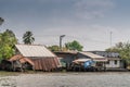 Dilapidated houses on stilts along Kinh 28 canal in Cai Be, Mekong Delta, Vietnam