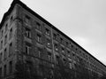 dilapidated industrial building with bricks and broken windows Royalty Free Stock Photo