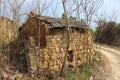 A dilapidated little tile house on the side of the road Royalty Free Stock Photo