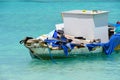 Dilapidated old boat filled with junk