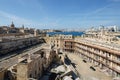 Dilapidated part of Fort St Elmo, Valletta with Sliema and Valletta in the background on a sunny day Royalty Free Stock Photo