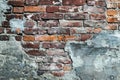 Dilapidated red brick wall, old ruined facade. Urban grunge stonewall, destroyed building, cement architecture background Royalty Free Stock Photo