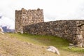 The dilapidated remains of an ancient mountain fortress. Wall and watchtower Royalty Free Stock Photo