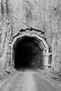A dilapidated stage coach tunnel on an old mountain dirt road