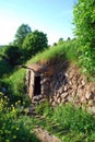 Entrance of an abandoned stone chapel near the spring. Spring, Holy spring of the virgin Mary in the village of Vydropuzhsk,